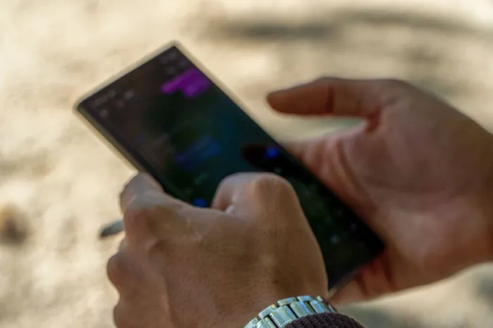 Hands holding a smartphone
