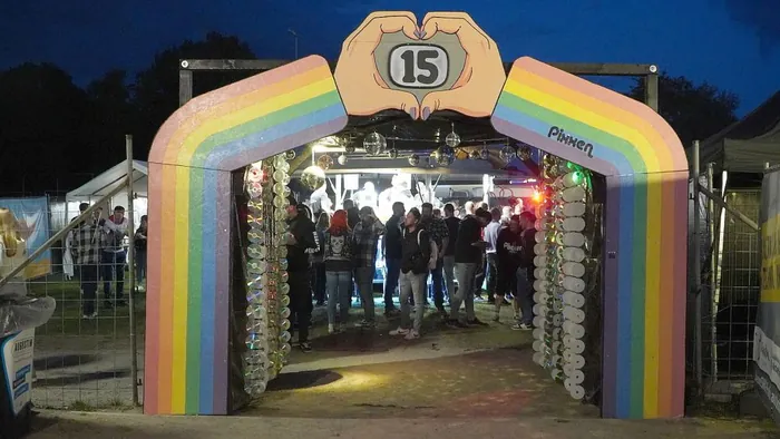 Rainbow entrance arch with a 15 sign at the Pixxen festival in Neukamperfehn