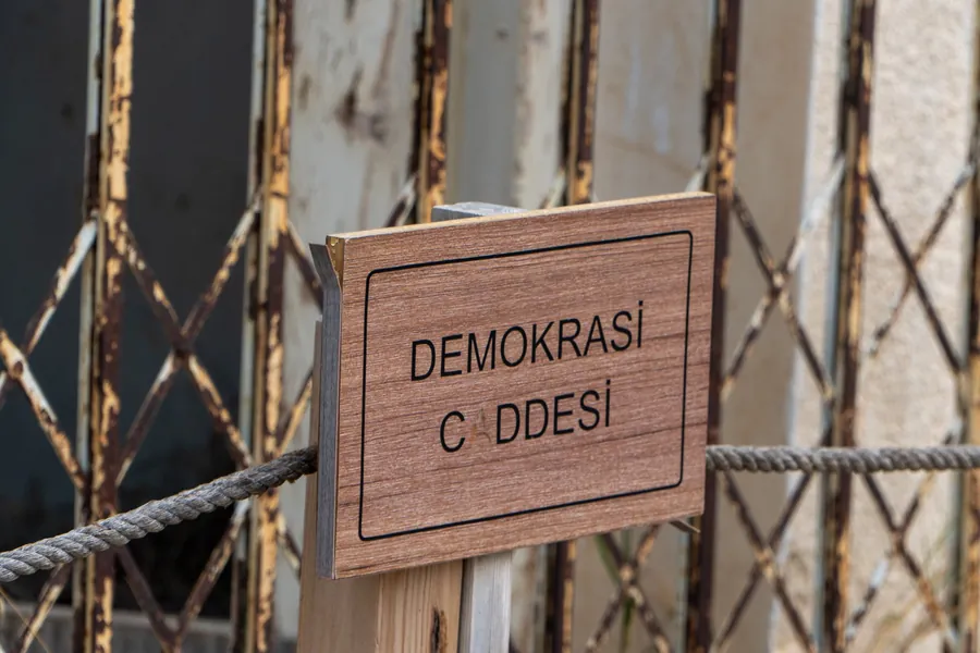 A street sign reading Demokrasi Caddesi